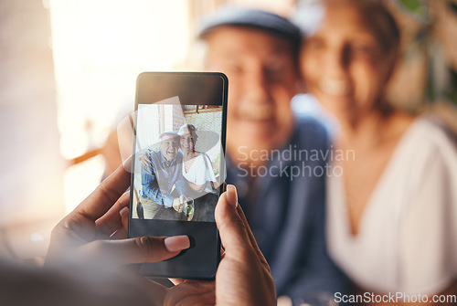 Image of Pov, phone and woman taking picture of old couple at restaurant. Love, smile and elderly, romantic and retired couple hug with person taking photo for happy memories, 5g mobile or social media post.