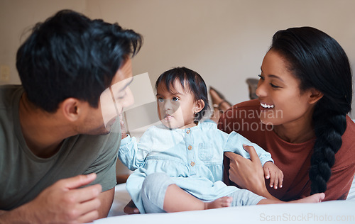 Image of Down syndrome, mother and father bonding with child smile, happy and together at home for quality time. Family, man and woman with baby, kid and newborn with disability, special needs and cuddle.