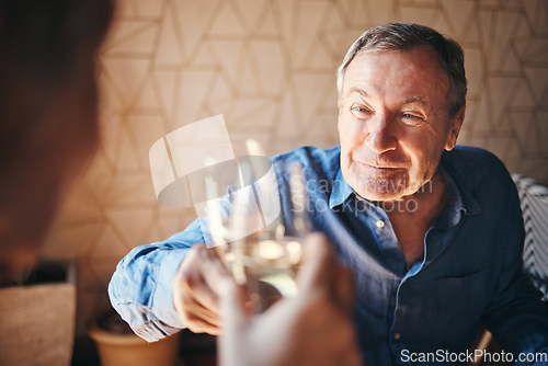 Image of Toast, glass and couple with a senior man and woman doing a cheers in celebration of their anniversary while on a date. Dating, love and retirement with an elderly pensioner drinking champagne