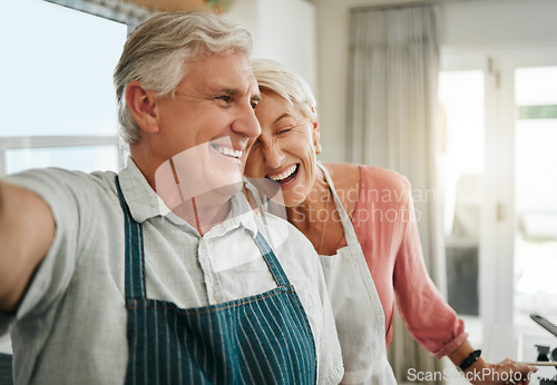 Image of Elderly, couple and selfie in home happy while cooking, baking or cleaning together in funny moment. Older man, woman and retirement laughing in kitchen, bonding and smile, to make food and joke