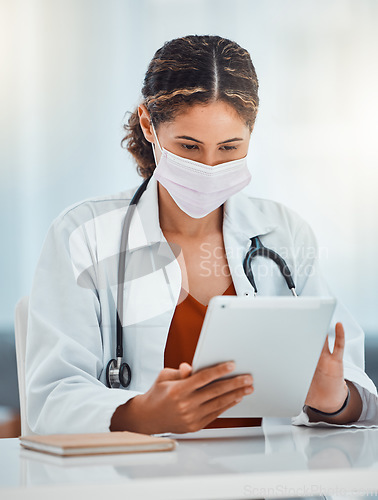 Image of Covid, doctor and woman with tablet working on covid 19, corona virus or medical healthcare research for pandemic solution. Digital mobile tech, telehealth and hospital employee with safety face mask