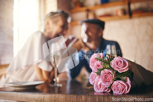 Image of Love, celebration and of roses for couple marriage anniversary with champagne for toast. Romantic, happy and caring senior people in relationship commitment together enjoy intimate date.