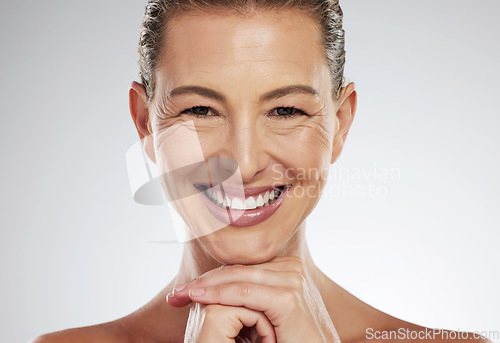 Image of Skincare, anti aging and beautiful mature woman with a smile on her face on white background. Beauty, botox and collagen, a middle aged lady from USA with health, wellness and wrinkles on clean skin