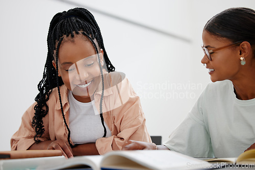 Image of Black woman, education and learning with books on table with girl, tutor or teacher. Friends, students and study together at desk with notebook for college, university or school while home in Phoenix