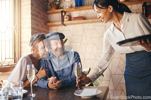 Image of Love, couple elderly and celebrate marriage with date and wine at restaurant, happy, smile or relax together. Loving, senior man and woman with champagne for celebration of retirement or anniversary