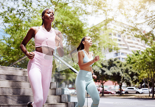 Image of Fitness friends, city running and women exercise together for healthy lifestyle, wellness and marathon training in urban outdoors. Focus athletes, runners and cardio challenge for powerful motivation