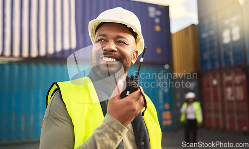Image of Man in logistics talking on radio, communication in shipping and transportation industry with a smile. Organization of commercial cargo, e-commerce containers and supply chain management of shipyard