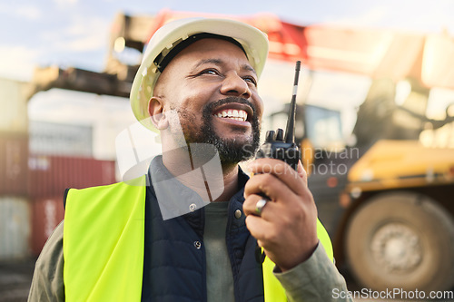 Image of Man using radio communication, shipping logistics and supply chain management to organize inventory. Freight cargo stock, commercial container for exports and import storage at a shipyard warehouse