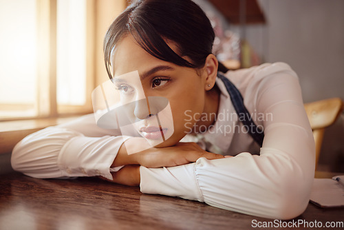 Image of Sad waiter in Paris cafe, woman tired at table in bistro and hospitality service industry job. Disappointed face in small business, bored fatigue at restaurant and mental health depression at work