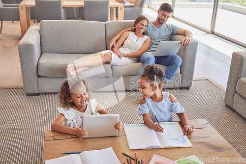 Image of Family, children and education with a girl learning about art with a book and tablet in the living room with their parents. Kids, student and homeschool with a mother, father and daughter in a house