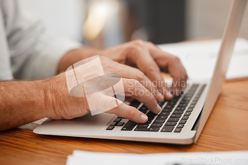 Image of Senior hands, laptop and typing email, online web search or writing article using computer keyboard at home. Closeup man, freelancer or remote worker using information technology with wifi connection