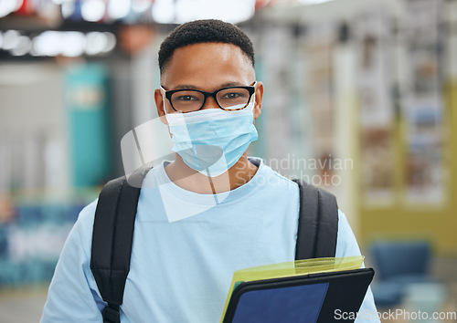 Image of Compliance, education and corona rules in a library with male student browsing books for homework or assignment. University, safety and covid in campus study with portrait of learner practice safety