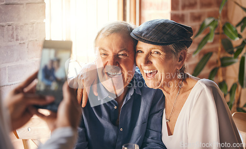 Image of Hands, phone and photography of senior couple smile together for joy, happiness and relationship love. Elderly, retired and married man and woman smiling, excited and happy for digital mobile photo