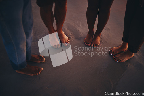 Image of Friends, sand and feet at a beach at sunset, relax and bonding on summer vacation in nature. Toes, fun and people travelling and exploring at the sea, standing and enjoying holiday and friendship