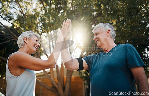 Image of Fitness senior couple high five for support, teamwork and exercise motivation with sunshine, outdoor exercise and wellness. Success, achievement or target goal of elderly people for workout results