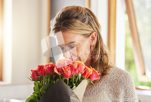 Image of Mature woman, scent and smelling roses in house or home for valentines day, birthday and celebration event. Flowers, plants and floral bouquet for person as thank you, sorry or congratulation gesture