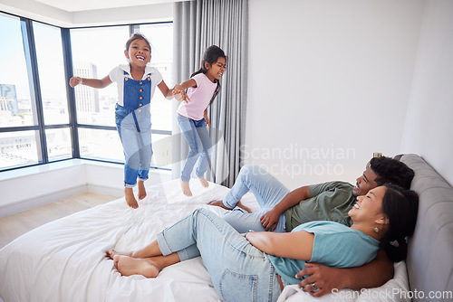 Image of Relax, happy family and kids jump on bed mattress in Philippines home with parents watching. Young, excited and happy children enjoy leisure fun together with mom and dad in cozy bedroom.