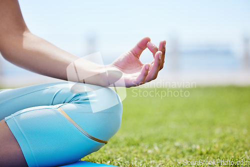 Image of Woman yoga meditation, zen and mudra hands in lotus pose for nature exercise, workout and peace outdoor grass. Calm energy, health and focus person in lotus training for mindset, wellness and relaxed