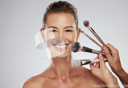 Image of Beauty, makeup and cosmetic brush by a senior woman face with a happy smile in a studio. Portrait of a elderly person face from Paris with happiness, cosmetics brushes and healthy skin smiling