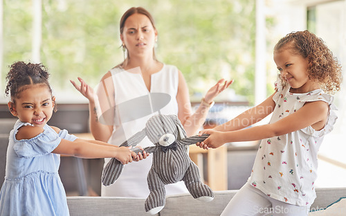 Image of Toys, fight and kids with angry children in conflict while mother confused about family problems or communication. Girl siblings upset about teddy bear with mom trying to talk in home living room