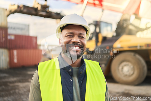 Image of Portrait, smile and work in logistics with container at export and distribution shipyard. Black man, happy and confident has motivation working in shipping, cargo and supply chain industry at port