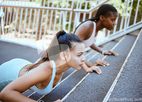 Image of Push ups, personal trainer and women workout on bridge for outdoor training or accountability. Wellness, fitness and strong athlete people exercise together for healthy lifestyle goal and support