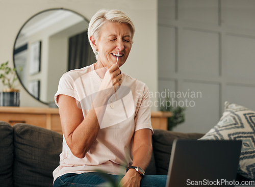 Image of Covid, laptop and pcr with senior woman laughing during online consultation or tutorial video for self test antigen rapid kit on home sofa. Old lady doing coronavirus nasal swab in Australia house