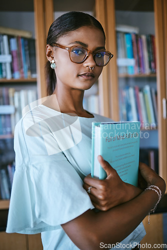 Image of Woman student with library print books from shelf for college or university education and learning knowledge. Young female or person with hardback English book in hands for studying or reading