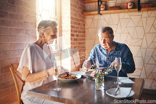 Image of Food, date and senior couple eating at fine dining restaurant and having lunch together at a table. Elderly man and woman with dinner in marriage at cafe or coffee shop during retirement for love