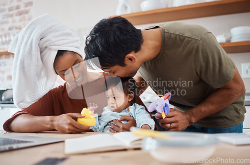 Image of Down syndrome, family and parents with toys for child, education and learning home kitchen. Mom, dad and baby together at table for playing, teaching and cognitive development in house in New York