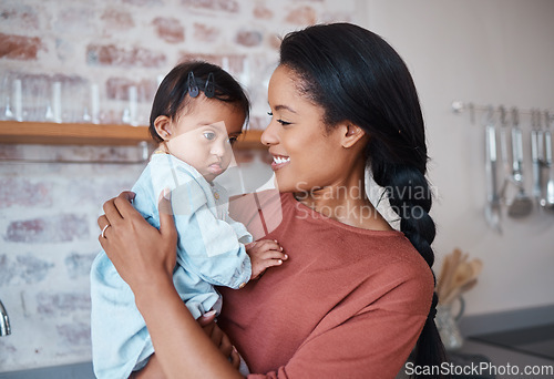 Image of Disability baby and mother holding down syndrome child with love and care in home with acceptance. Puerto Rico family with young disabled kid and support of mom with cheerful smile embracing her.