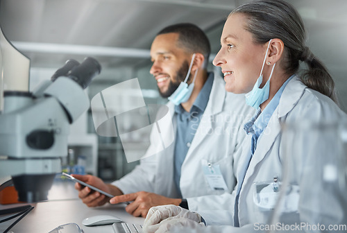 Image of Teamwork, science and scientist working on covid research, biotechnology and dna data analysis together in laboratory. Smile, collaboration and happy woman reading medical information with a partner