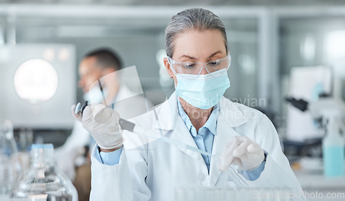 Image of Covid, lab mask and vaccine research woman with medicine analysis test tube in a lab. Medical development, innovation and professional science expert working on new medical analytics in a laboratory