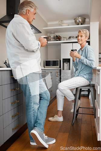 Image of Coffee, love and couple with a senior man and woman drinking coffee together in the kitchen of their home. Retirement, smile and morning with an elderly male and female pensioner enjoying tea