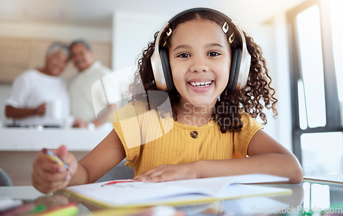 Image of Girl portrait, homework and music for drawing, art and homeschool creative notebook, fun and education in family home. Happy child, studying and learning with headphones for audio listening at table