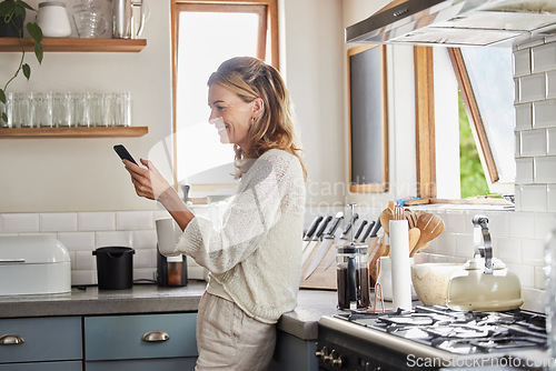 Image of Mature woman reading phone news, social media notification and mobile apps in Australia kitchen home. Happy lady typing smartphone, online social network and 5g web technology connection in apartment