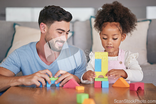 Image of Father, adopted child and building blocks on table playing with little girl in living room at home. Happy dad smiling in playful build activity with colorful shapes, toys and daughter in development