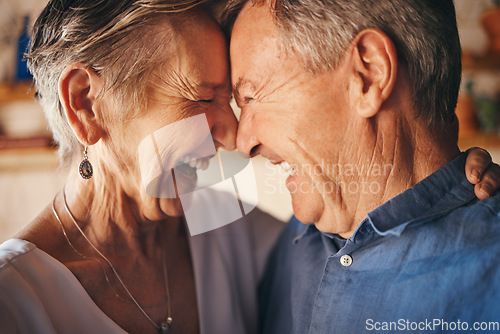Image of Happy senior couple, laughing and forehead faces in joyful happiness and love for relationship together at home. Closeup of elderly man and woman laugh and smile in funny, loving and touching moment