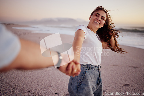 Image of Pov, couple and holding hands on beach, sand and happy together, relax and smile on holiday, vacation and trip. Love, man and woman on seaside getaway enjoy the sunset, embrace and fun being romantic