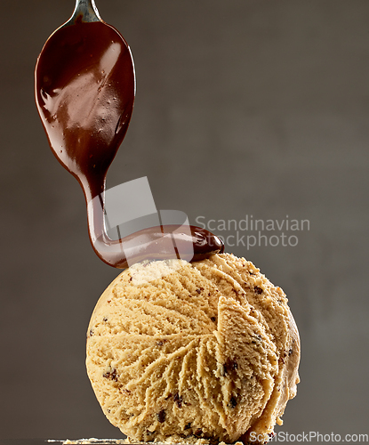 Image of caramel ice cream with melted chocolate