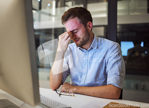 Image of Burnout, stress and tired businessman with mental health problems struggling while working overtime in an office. Depression, headache and frustrated manager with eye strain, exhausted and overworked