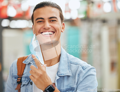 Image of University student remove face mask, end of covid and safety for learning, education and studying at back to school college in Portugal. Portrait happy campus man excited for corona virus freedom