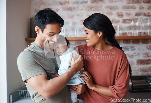 Image of Down syndrome, happy family and baby in a kitchen, bonding and embracing in their home together. Child development, love and special needs care for disability by asian parents enjoy morning indoors