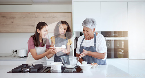 Image of Women in kitchen teaching girl baking cake or cookies for family. Happy grandmother, mom and young child learning with cooking ingredients in family home make snack, biscuit or flour while have fun
