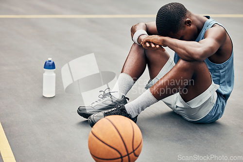 Image of Tired, depression or sad basketball player with training gear after game fail, mistake or problem. Depressed, mental health and anxiety or stress sports, athlete teenager man frustrated with results