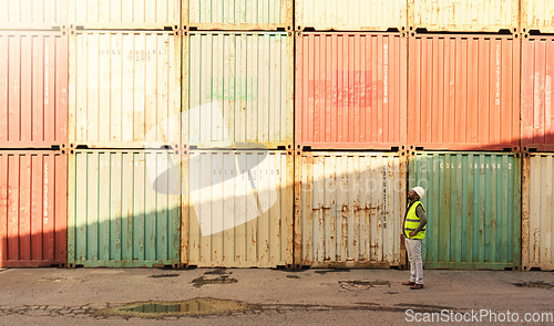 Image of Logistics container, delivery and black man doing inspection of cargo at an outdoor distribution warehouse. African port manager planning shipping of stock while working in the supply chain industry
