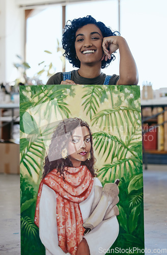 Image of Art, portrait and woman with pride in her painting while working at a creative studio. Happy Indian artist, designer or painter while watercolor design with paint on canvas in a professional workshop