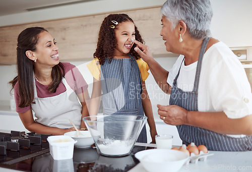 Image of Family baking, flour fun and grandmother teaching children to bake cake in the kitchen of their home. Happy girl, mom and senior person cooking together, learning about food and being playful