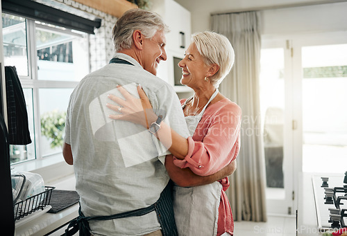 Image of Cooking dance, dinner and senior couple dancing with smile while making lunch in the kitchen of house. Happy elderly man and woman doing jazz movement with love to music while preparing food in home