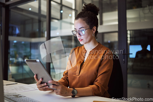 Image of Woman working in Toronto office at night, big data analytics and reading expert research on digital tablet. Database administrator in dark, overtime work on company report and iot in tech business